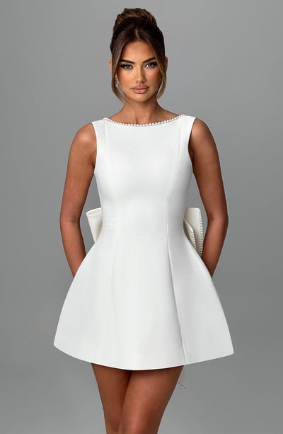 Hollis - Elegant Pearl Bow Mini Dress